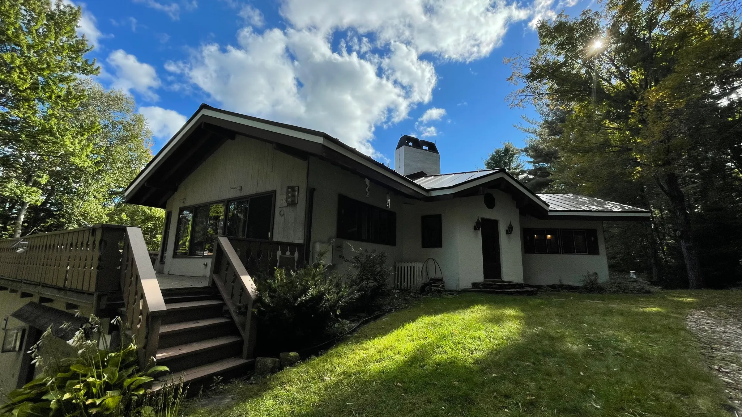 The chalet exterior under an autumn sky