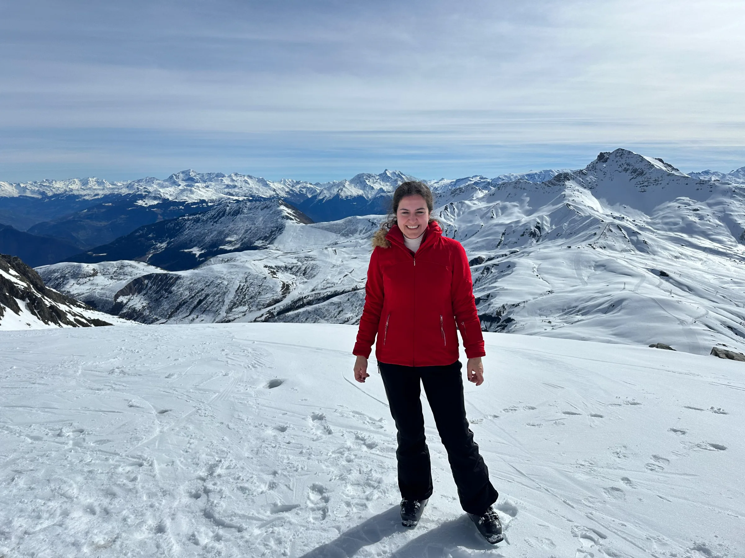 A guest on a snowy summit above the mountains