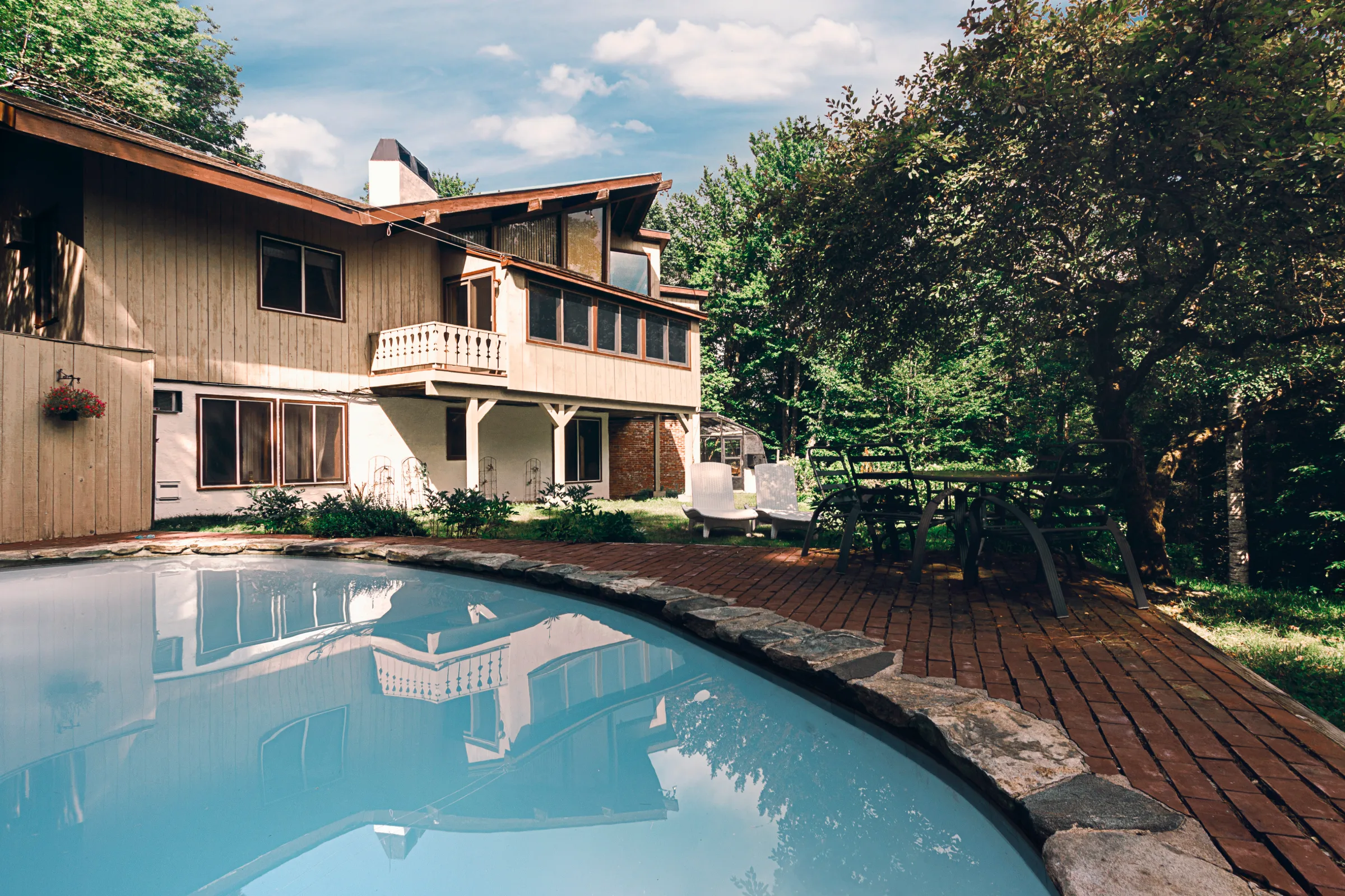 The Paradise Vermont chalet and pool in summer