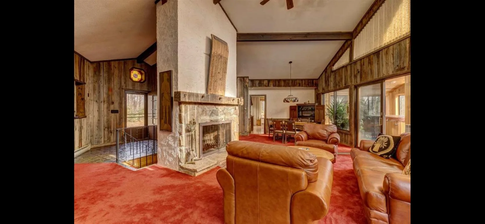 The great room hearth, dining and stairwell beyond