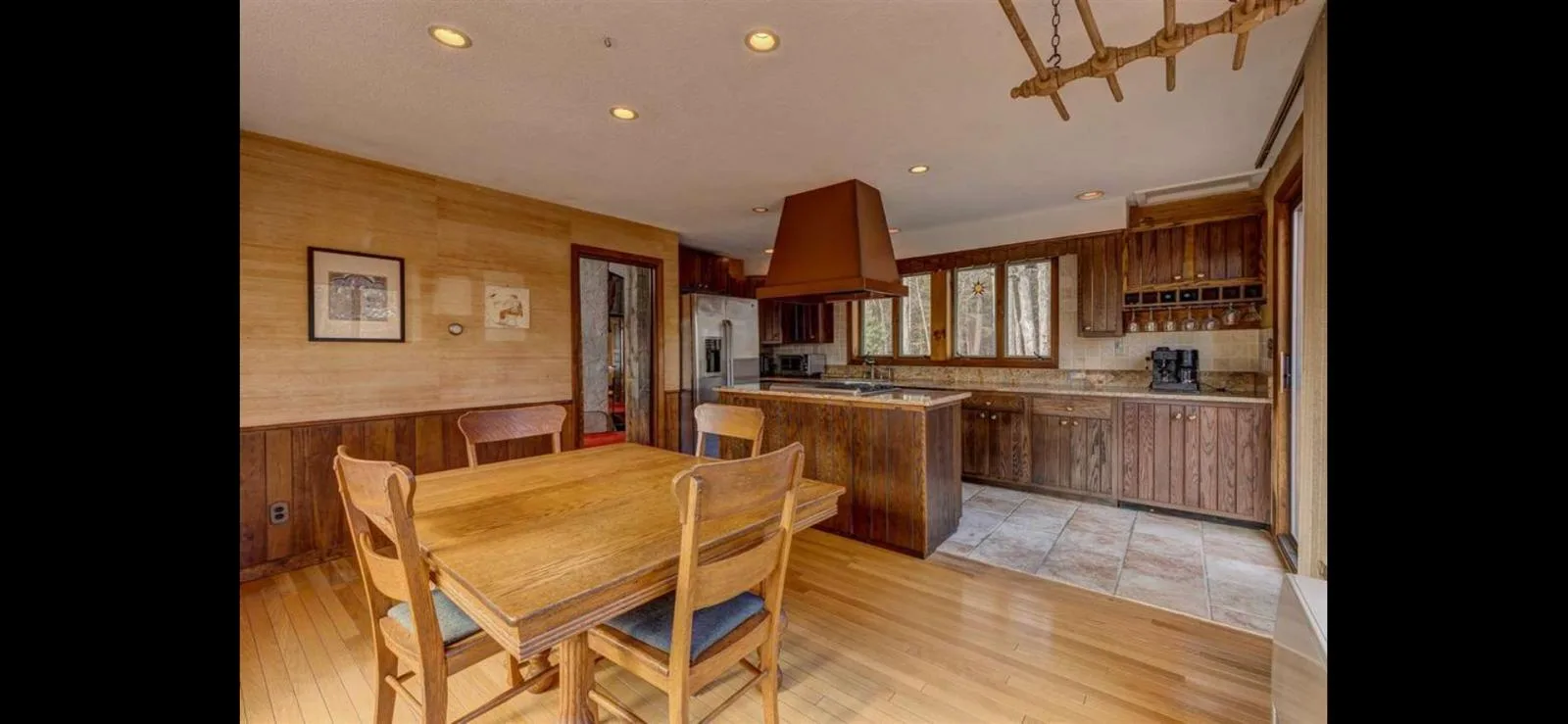 The kitchen and breakfast table in warm wood